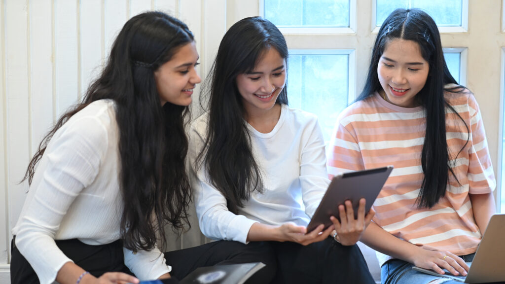 University student doing E-learning group by using a computer ta